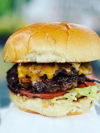 The Fed. Burger — ground beef, cheddar, chipotle sauce on a brioche bun